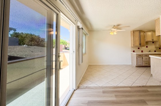 Bright Upper Unit with Balcony and Carport